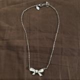 American Eagle Outfitters Jewelry | Ae Bow Costume Necklace | Color: Silver | Size: Os