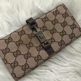 Gucci Bags | Authentic Gucci Canvas Gg Bifold Wallet | Color: Brown/Tan | Size: Os