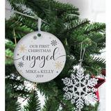 The Holiday Aisle® Our First Christmas Engaged Round w/ Snowflakes Design Ball Ornament Wood in Brown, Size 3.75 H x 3.75 W x 0.13 D in | Wayfair