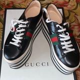 Gucci Shoes | Gucci Platforms!Good Condition W Lil Staining Around The Rim Of The Sneaker. | Color: Black/White | Size: 8