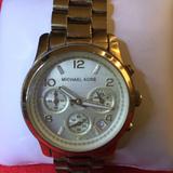 Michael Kors Accessories | Michael Kors Midsized Gold-Tone Unisex Watch | Color: Gold | Size: Fits 7 Wrist.
