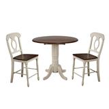 "Sunset Trading Andrews 3 Piece 42"" Round Drop Leaf Pub Table Set In Antique White and Chestnut Brown With Napoleon Stools - Sunset Trading DLU-ADW4242CB-B50-AW3PC"