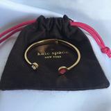 Kate Spade Jewelry | Kate Spade Logo Hinge Cuff Bangle Bracelet | Color: Gold/Red | Size: Os