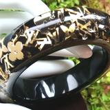 Louis Vuitton Jewelry | Hplouis Vuitton Elegant Inclusion Black Gold Bangle Resin Lv Bracelet Ln | Color: Black/Gold | Size: Large 7 12 Round