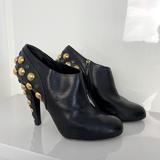 Gucci Shoes | Gucci Leather Ankle Boots With Gold Metal Design | Color: Black | Size: 10