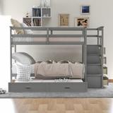 Twin Over Twin 4 - Drawer Solid Wood Bunk Bed w/ Trundle by Harriet Bee Wood in Brown, Size 65.7 H x 42.4 W x 97.2 D in | Wayfair