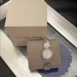 Michael Kors Accessories | Tell Time In A Silver Link Michael Kors Watch | Color: Silver/White | Size: Os