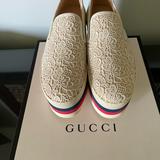Gucci Shoes | Gucci Womens Cream Lace Floral Slip On Platform Sneaker - Nwt - Sz 10 Us | Color: Cream | Size: 10