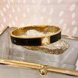 Kate Spade Jewelry | Kate Spade Black New York Hole Punch Hinge Bangle Bracelet In Black And Goldtone | Color: Black/Gold | Size: Os
