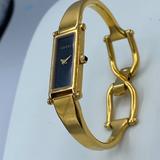 Gucci Accessories | Gucci Gold 1500l Bangle 12.1mm Women's Black X 1829682 Watch | Color: Black/Gold | Size: Medium