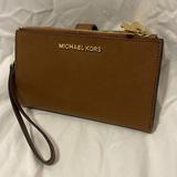 Michael Kors Bags | Brown Leather Micheal Kors Wallet, No Tag But Never Used. | Color: Brown/Tan | Size: Wallet Clutch Size
