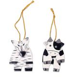 Wood ornaments, 'Zebra and Cow' (pair)