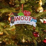 The Holiday Aisle® Woof I love my dogs Personalized Hanging Figurine Ornament in Green/Red, Size 2.5 H x 4.1 W x 0.8 D in | Wayfair