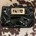 Michael Kors Bags | Michael Kors Black & Gold Patent Leather Clutch | Color: Black/Gold | Size: Os