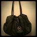 Michael Kors Bags | Michael Kors Black Leather Bag With Tassel | Color: Black/Gold | Size: Os