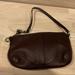 Coach Bags | Coach Dark Brown Pebbled Leather Wristlet | Color: Brown | Size: 7.5”W X 4.5”H