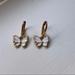 Brandy Melville Jewelry | Gold And White Butterfly Hoops | Color: Gold/White | Size: Os