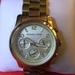 Michael Kors Accessories | Michael Kors Midsized Gold-Tone Unisex Watch | Color: Gold | Size: Fits 7" Wrist.