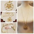 Jessica Simpson Jewelry | Jessica Simpson Star Burst Pendant Necklace Gold | Color: Gold | Size: Os