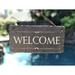 Gracie Oaks Ireen Welcome Wall Décor Stone in Gray | 8 H x 18 W in | Wayfair 99EC1ED8D30343A794CEE5F0F39D81C3