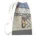 East Urban Home Banksy Graffiti Burning Tire Wide Laundry Bag Fabric | 29 H in | Wayfair 72A77BCCD8DC4C8FAFE0B6888A3952B3