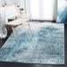 Blue/Gray 79 x 0.35 in Indoor Area Rug - Trent Austin Design® Mclawhorn Abstract Teal Area Rug Polypropylene | 79 W x 0.35 D in | Wayfair