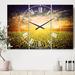 Designart 'Beauty Sunset over Sunflowers Field' Cottage 3 Panels Large Wall CLock - 36 in. wide x 28 in. high - 3 panels