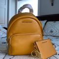 Michael Kors Bags | Mustard Yellow Convertible Michael Kors Backpack | Color: Orange/Yellow | Size: Adjustable Straps