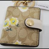 Coach Other | Coach Signature Pvc Picture Frame Bag Charm Keychain With Daisy Print Khaki | Color: Tan/Yellow | Size: Os