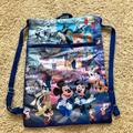 Disney Bags | Disneyland 60th Sling Backpack | Color: Blue/Gold | Size: Os