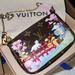 Louis Vuitton Accessories | Authentic Louis Vuitton Vivienne Mini Pochette | Color: Black | Size: Mini