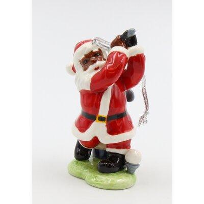 The Holiday Aisle® African American Santa Golfer Hanging Figurine Ornament Ceramic/Porcelain in Red | 4 H x 2 W x 3 D in | Wayfair