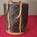 Louis Vuitton Bags | Louis Vuitton Monogram Canvas Petit Bucket Tote | Color: Brown/Tan | Size: 14 1/4" High 12.5 " Wide