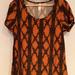 Lularoe Tops | Lularoe Black/Orange Print Classic T Size Xs Nwt | Color: Black/Orange | Size: Xs