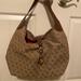 Dooney & Bourke Bags | Dooney & Bourke Tan Lobster-Claw Monogram Canvas Slouch Shoulder Bag | Color: Tan | Size: Os