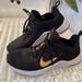 Nike Shoes | Nike Air Max Bella Tr Running Sneaker. Black With Gold Swoop. Size 10. Like New | Color: Black/Gold | Size: 10