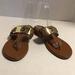 Michael Kors Shoes | Michael Kors Women’s Thong Flat Sandals | Color: Brown/Gold | Size: 7.5