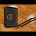 Michael Kors Accessories | Black Michael Kors Wristlet With Gold Features. | Color: Black | Size: Os