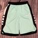 Nike Other | Green Back And White Nike Basketball Shorts. | Color: Black/Green/White | Size: Extra Large