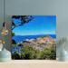 Highland Dunes Green Grass On Brown Rock Formation Near Blue Sea Under Blue Sky During Daytime | 12 H x 12 W x 2 D in | Wayfair