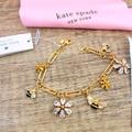 Kate Spade Jewelry | Kate Spade All Abuzz Stone Bee And Flower Charm Bracelet Yellow Gold Nwt | Color: Gold | Size: Os