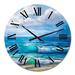 Designart 'Light Reflecting Trhough Sea Waves At The Shore' Nautical & Coastal wall clock