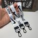 Nike Accessories | 3 Pcs Nike Short Lanyard Wristlet Phone Car Bag Charm Keychain | Color: Black/White | Size: Os