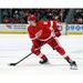 Moritz Seider Detroit Red Wings Unsigned Handling the Puck Photograph