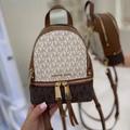 Michael Kors Bags | Michael Kors Rhea Zip Xs Backpack | Color: Brown/Cream | Size: Os