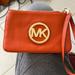 Michael Kors Bags | Michael Kors Leather Wristlet | Color: Orange | Size: Os