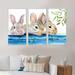 Gracie Oaks Three Fluffy Rabbits Behind a Wooden Fence - 3 Piece Floater Frame Print on Canvas Metal in Blue | 32 H x 48 W x 1 D in | Wayfair