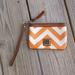 Dooney & Bourke Bags | Dooney & Bourke Chevron Coated Cotton Leather Wristlet Wallet Orange White | Color: Orange/White | Size: Os