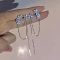 Boucles d'oreilles longues avec pompon fleur en cristal mancommuniste clip d'oreille personnalité