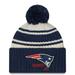 Youth New Era Cream/Navy England Patriots 2022 Sideline Sport Cuffed Pom Knit Hat